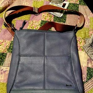 Cross body sak in excellent condition. Use one time still have tags beautiful l